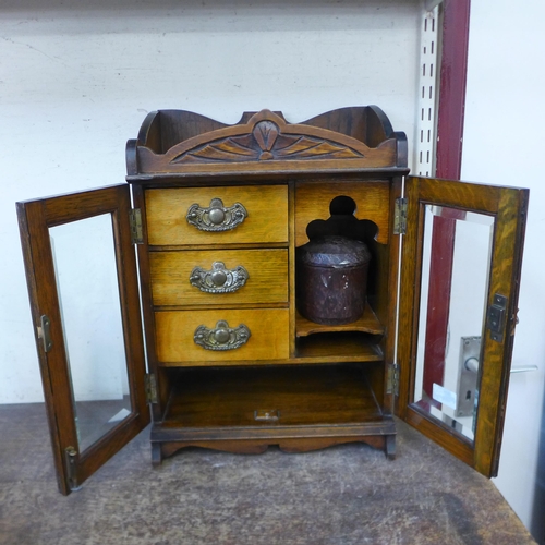 395 - A late Victorian oak wall hanging smokers cabinet