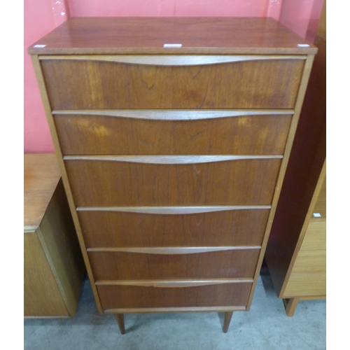 4 - An Austin Suite teak chest of drawers