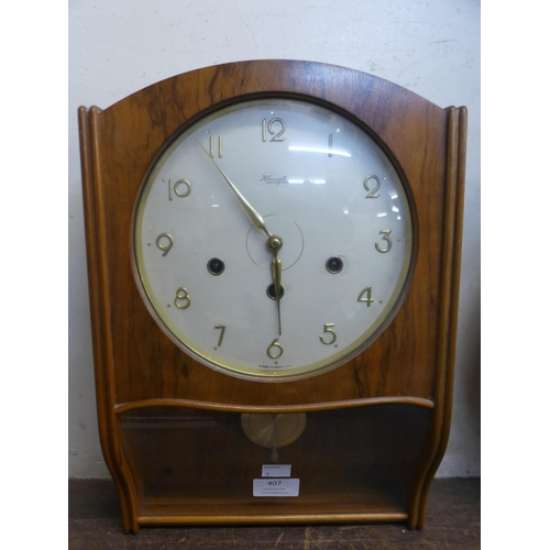 407 - A German Hermle faux walnut wall hanging clock