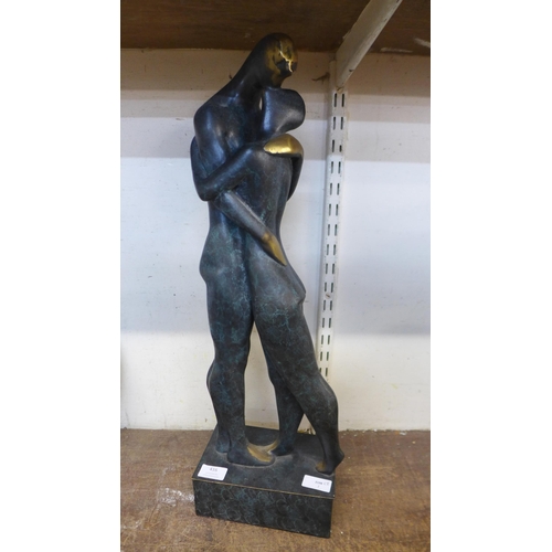 416 - A Surrealist style bronze figure of lovers