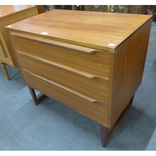 65 - A teak chest of drawers
