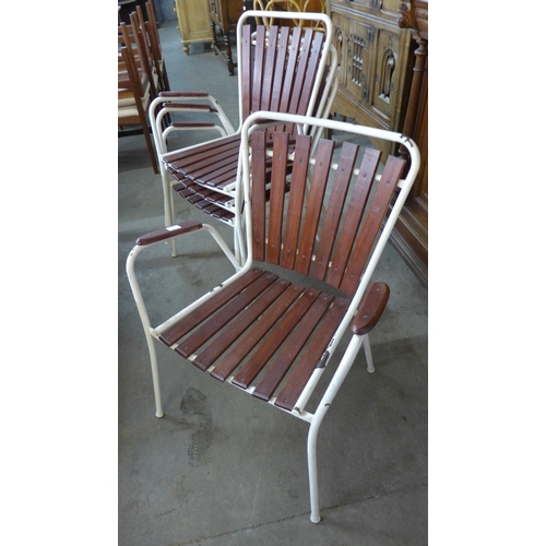 75 - A set of four Danish Daneline teak and white tubular metal garden chairs