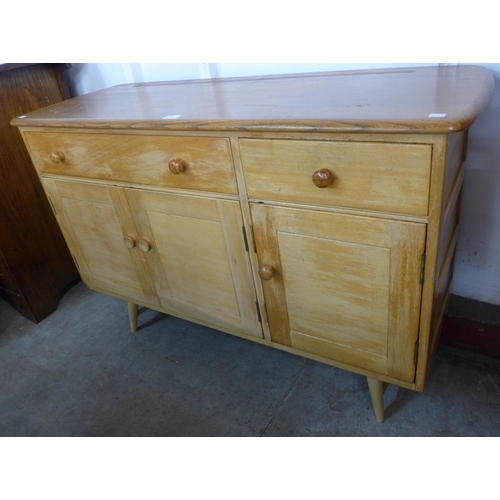 83 - An Ercol Blonde elm and beech Windsor sideboard