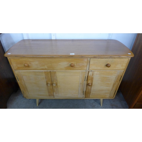 83 - An Ercol Blonde elm and beech Windsor sideboard