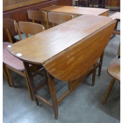 97 - A teak drop-leaf dining table and four chairs