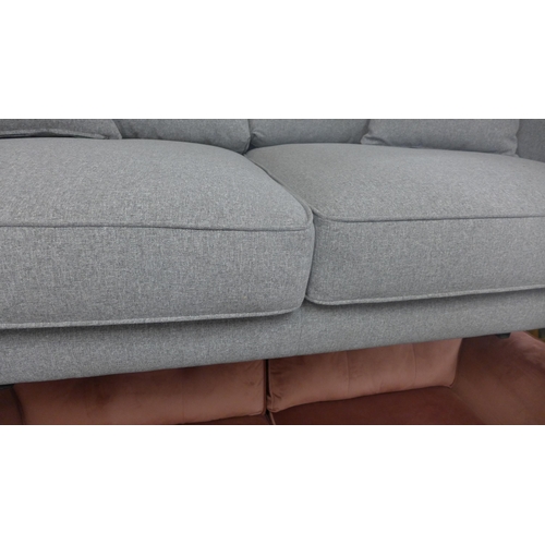 1379 - A mid grey upholstered 2.5 seater sofa