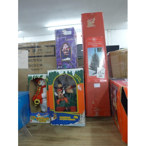 2392 - A collection of Christmas items including a 'New Forest Pine' 3ft Christmas tree, a 24cm musical San... 