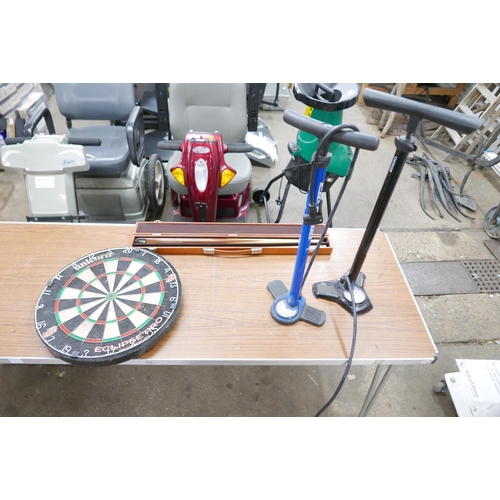 2407 - 2 Saddle pumps, a Unicorn dartboard and a  Malibu snooker cue