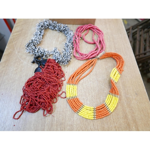 2128 - A box of statement necklets