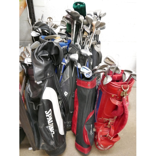 2193 - Golf clubs and bags, 7 adult drivers, putters and irons and a Junior set