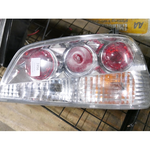 2456 - A set of Peugeot 306 rear headlights, a trailer board with power cable, a metal dog guard and an eme... 