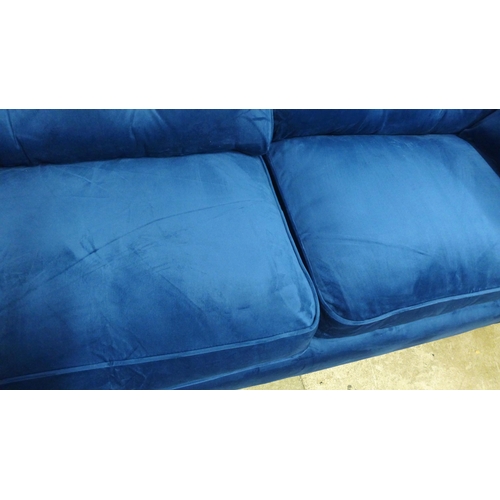 1997 - A pair of Hoxton blue velvet upholstered three seater sofas RRP £1598