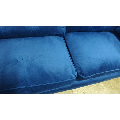 1996 - A pair of Hoxton blue velvet upholstered three seater sofas RRP £1598