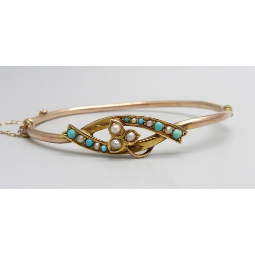 1299 - A 9ct gold, turquoise and pearl bangle, 4.7g