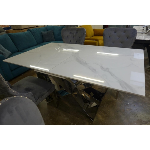 1302 - A Marvel 1.6-2m extending dining table with a set of four Chelsea grey velvet upholstered dining cha... 