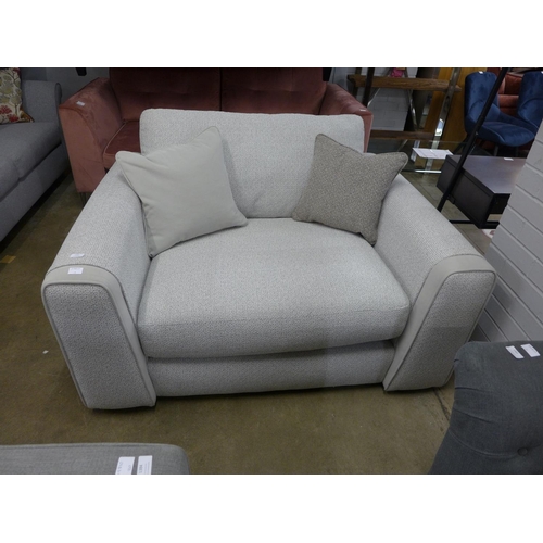 1324 - A textured weave light grey love seat