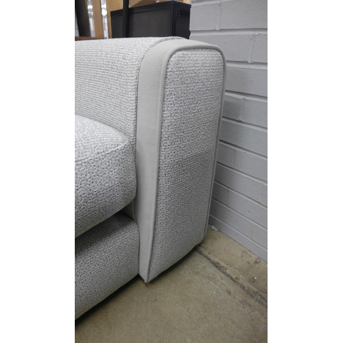 1324 - A textured weave light grey love seat