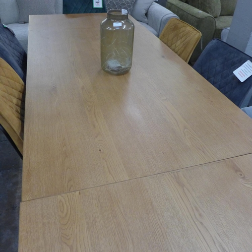 1342 - An oak 1.5m - 2.4m extending dining table with black legs and a harlequin set of six diamond stitch ... 