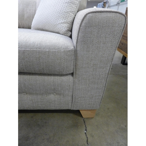 1412 - An oatmeal textured weave upholstered 2.5 seater sofa