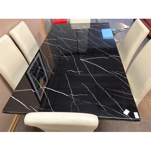 1418 - A black and white marble effect dining table and six white leather effect chairs