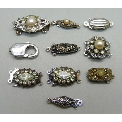 1000 - Ten silver clasps, two a/f with stones missing