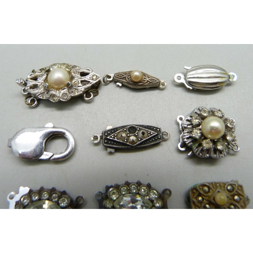 1000 - Ten silver clasps, two a/f with stones missing