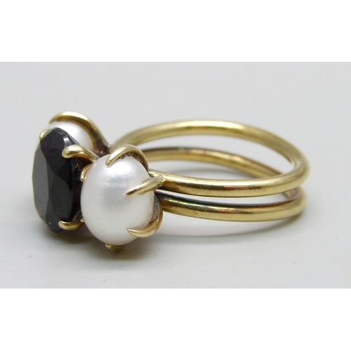 1001 - A yellow metal, garnet and egg shaped pearl ring, hand made in the Philippines, circa 1970, 6.5g, K