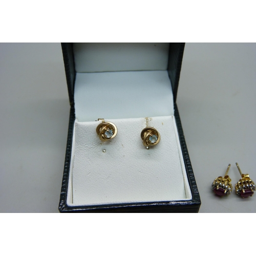 1002 - A pair of silver gilt cluster earrings set with rubies, two pairs of unmarked yellow metal earrings,... 