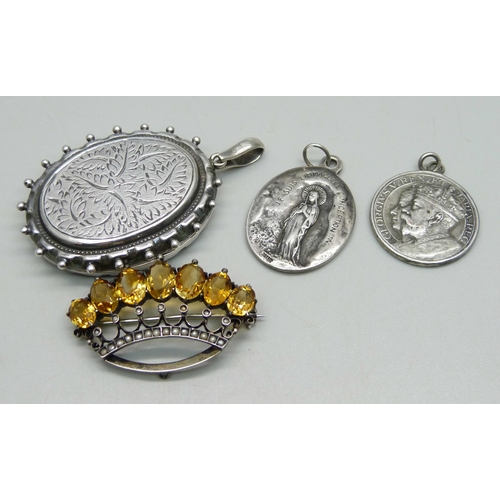 1003 - An .800 silver crown brooch set with seed pearls and citrine, a Victorian white metal locket (later ... 