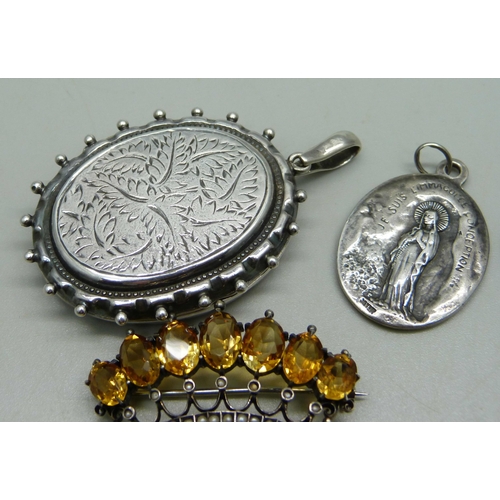 1003 - An .800 silver crown brooch set with seed pearls and citrine, a Victorian white metal locket (later ... 