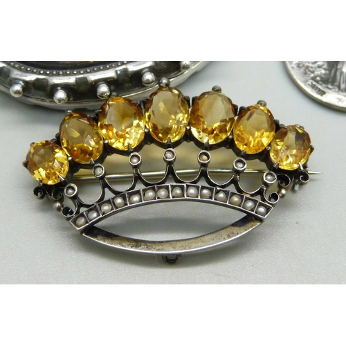 1003 - An .800 silver crown brooch set with seed pearls and citrine, a Victorian white metal locket (later ... 