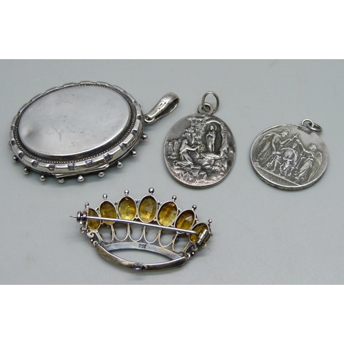 1003 - An .800 silver crown brooch set with seed pearls and citrine, a Victorian white metal locket (later ... 