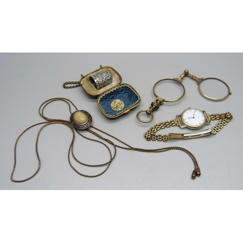 1004 - A lady's Omega de Ville wristwatch, a pair of plated lorgnettes, a silver thimble in miniature carry... 