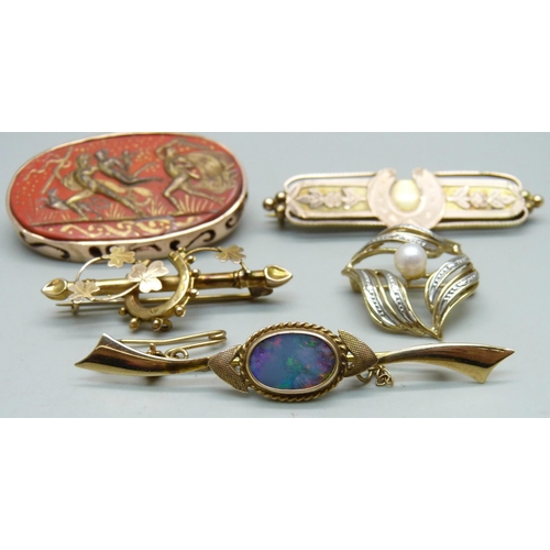 1011 - Two 9ct gold bar brooches with horseshoe designs, a 9ct gold and opal doublet set bar brooch, a 9ct ... 