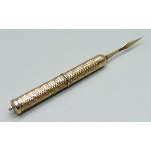 1022 - A 9ct gold tooth pick, 6.8g