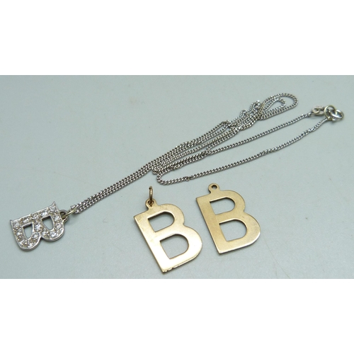 1024 - A white metal and diamond 'B' pendant on an 18ct gold chain, 5.4g and two 9ct gold 'B' pendants, 4g