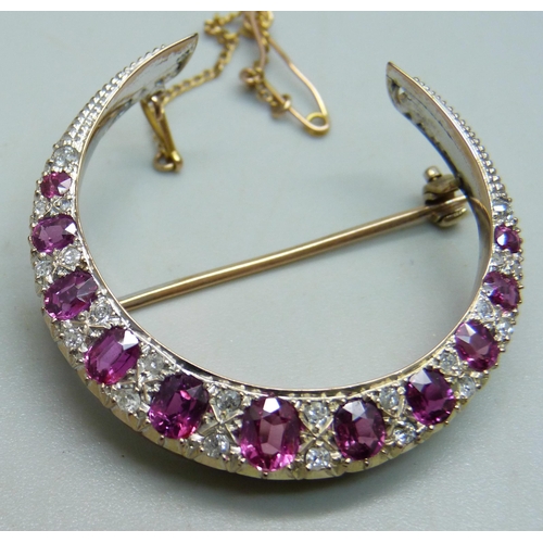 1026 - A yellow metal crescent brooch set with rubies and diamonds, 8g, 3.8cm