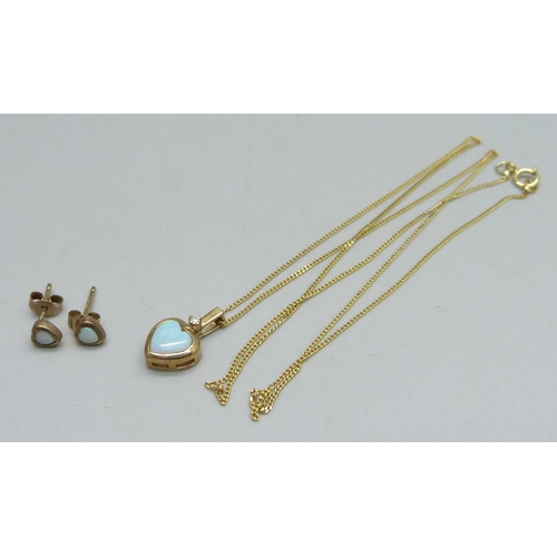 1027 - A 9ct gold pendant on chain set with an opal and a small diamond and a pair of matching 9ct gold ear... 