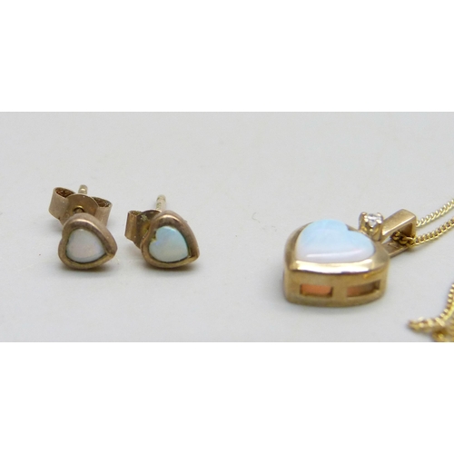 1027 - A 9ct gold pendant on chain set with an opal and a small diamond and a pair of matching 9ct gold ear... 