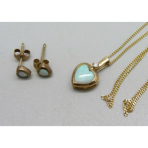 1027 - A 9ct gold pendant on chain set with an opal and a small diamond and a pair of matching 9ct gold ear... 