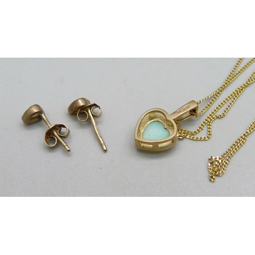 1027 - A 9ct gold pendant on chain set with an opal and a small diamond and a pair of matching 9ct gold ear... 