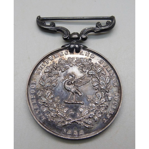 1035 - A medal marked Lord, Save Us, We Perish, awarded to J.R. Carnon, 2nd officer, S.S. Philadelphian in ... 