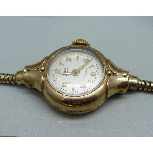 1058 - A 9ct gold cased lady's Rotary wristwatch on a plated strap, a silver cased Medana wristwatch (back ... 