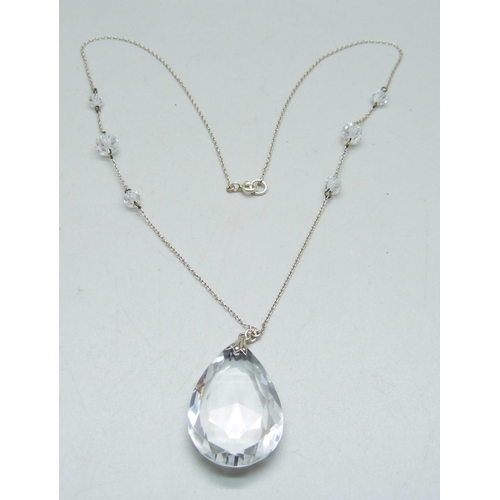 1064 - A circa 1930 rock crystal faceted teardrop pendant with fancy spacers on silver chain, 16.9g, 56cm a... 