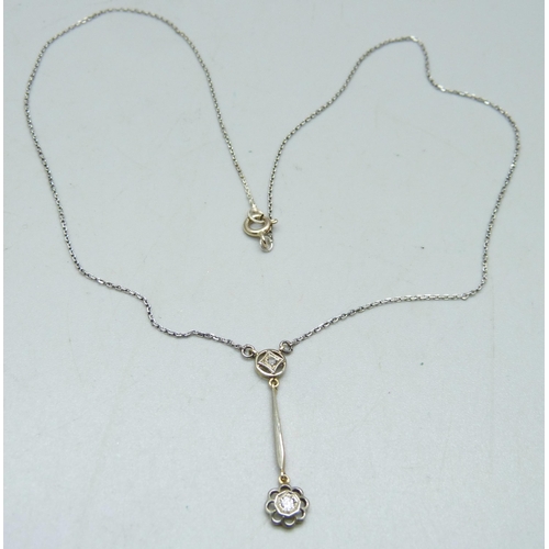 1065 - An Edwardian 15ct yellow gold with platinum wash diamond pendant on a white metal chain, in original... 