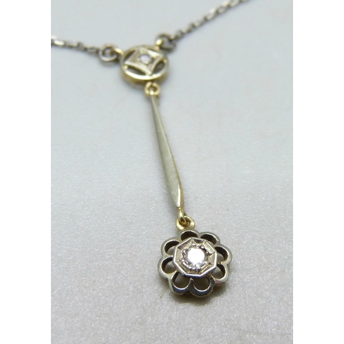 1065 - An Edwardian 15ct yellow gold with platinum wash diamond pendant on a white metal chain, in original... 