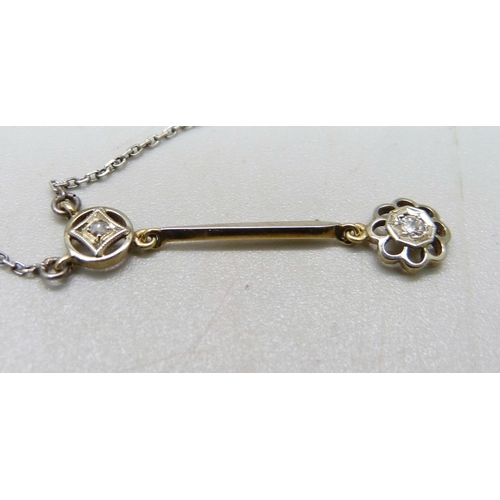 1065 - An Edwardian 15ct yellow gold with platinum wash diamond pendant on a white metal chain, in original... 