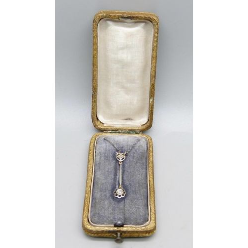 1065 - An Edwardian 15ct yellow gold with platinum wash diamond pendant on a white metal chain, in original... 