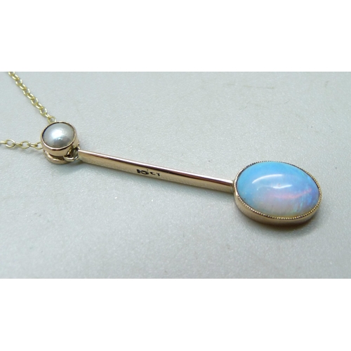 1067 - An Edwardian Australian crystal opal pendant set in 15ct yellow gold with split pearl bail on a fine... 