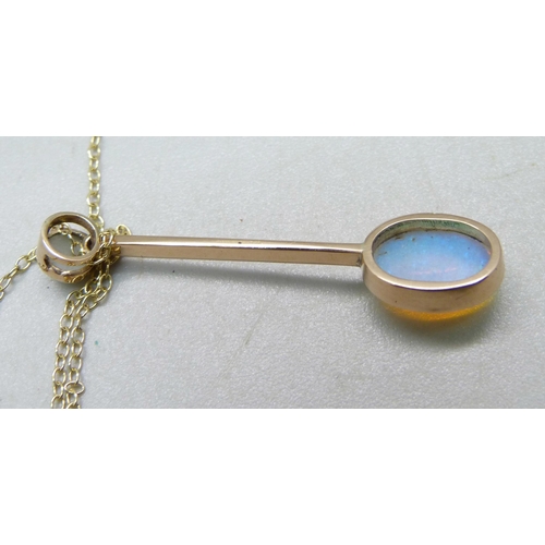 1067 - An Edwardian Australian crystal opal pendant set in 15ct yellow gold with split pearl bail on a fine... 